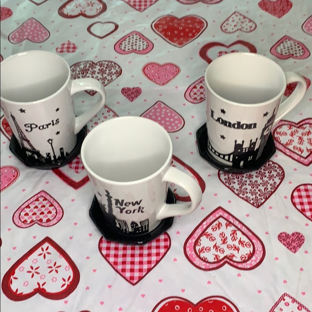A set of three mugs and coasters NWT.